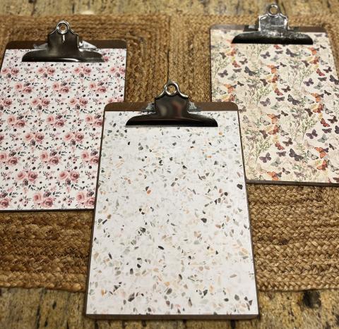 three decorative clipboards