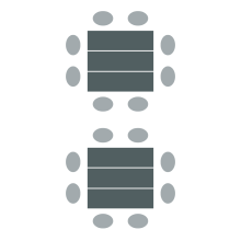 Three tables pushed together to create a larger space to seat up to eight. 